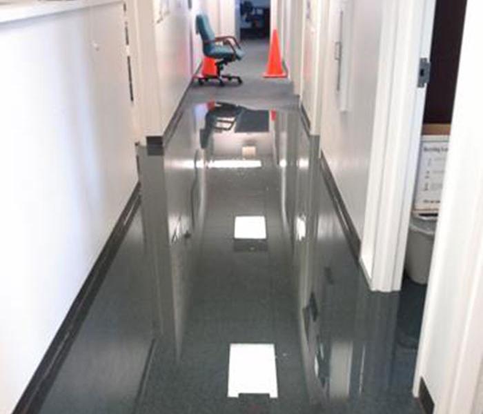 Water in hallway of office building